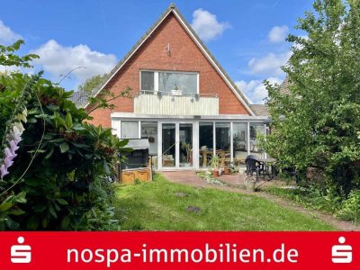 Einfamilienhaus mit beheizbarem Wintergarten, massiver Garage und Terrasse