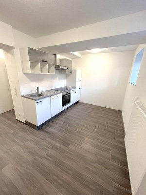2-Zimmer-Souterrain Wohnung mit Gemeinschaftsterrasse