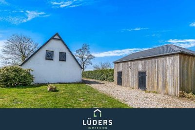 Einfamilienhaus auf großem Grundstück in Feldrandlage