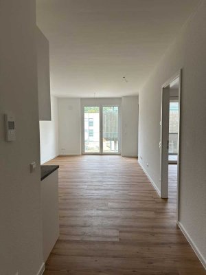 Neubau mit Balkon und Einbauküche: Stilvolle 2,5-Zimmer-Wohnung mit geh. Innenausstattung