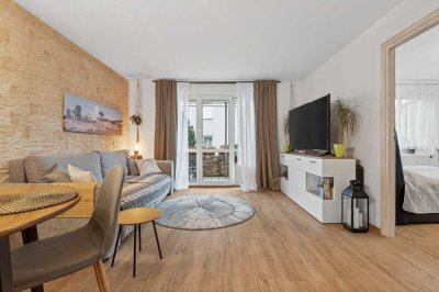 Ihr neues Zuhause: Lichtdurchflutete Erdgeschosswohnung mit Balkon und Tiefgarage