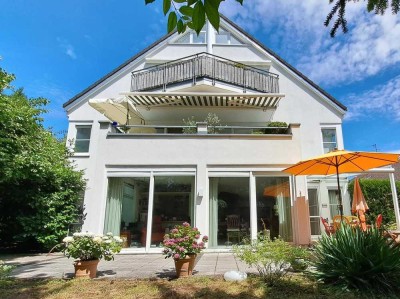 Helle EG-Wohnung mit eigenem Garten, zwei Terrassen und zwei TG-Stellplätzen am Steinberg