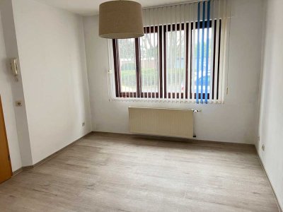 Erdgeschoss-Wohnung für 1 Person mit Terrasse und Einbauküche in zentraler Lage