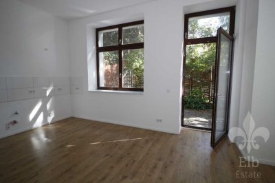 Kleine grüne Oase im lebendigen Viertel - 2 Raum Wohnung mit Terrasse, Wohnküche, Fußbodenheizung