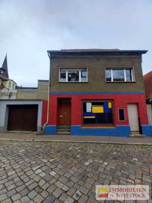 Einfamilienhaus mit Ladenlokal in zentraler Stadtlage