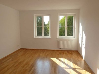 Familienfreundliche 4-Raum-Wohnung mit Balkon im charmanten Gebäudeensemble "Hoffmanns Gärten"