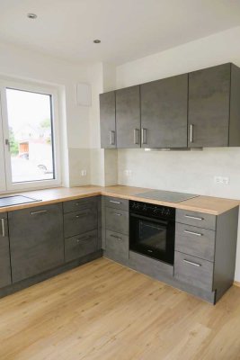 3-Zimmer Erdgeschosswohnung in hochwertiger Ausstattung! Küche, Garten und Garage!