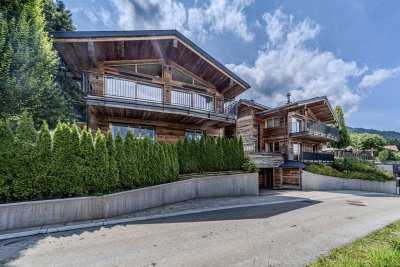 Edle Chalets in „Ski-in &amp; Ski-out“-Lage mit imposanten Kaiserblick