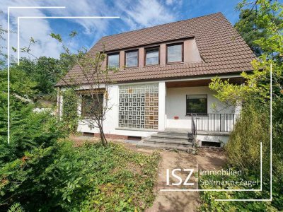 Haus + Grundstück unter Bodenrichtwert! - Sanierungsbedürftiges EFH mit ELW und 2 Garagen