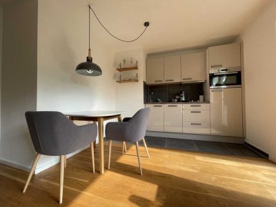 Sanierte, vollmöblierte 2-Zimmer-Wohnung mit Terrasse + Garten