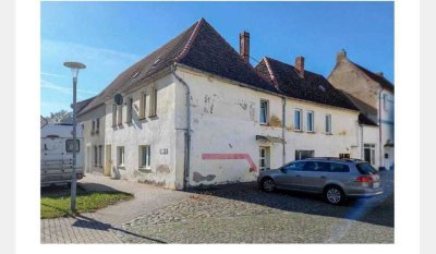 Modernisierungspotenzial in Top-Lage! Wohn- & Geschäftshaus als lukratives Sanierungsobjekt.