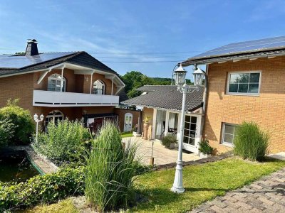 Traumhaftes Einfamilienhaus mit Nebengebäuden, Photovoltaik & großem Garten in idyllischer Lage!