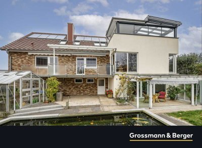 Zweifamilienhaus mit zwei Gewerbehallen