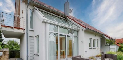 Modernes Wohnen mit Weitblick – Einfamilienhaus mit Designküche, Wintergarten und Raumvielfalt
