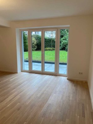 Top-sanierte 2 Zimmer-Gartenwohnung mit Terrasse und neuem Parkett in Oberkassel / 2-Zimmer KDB