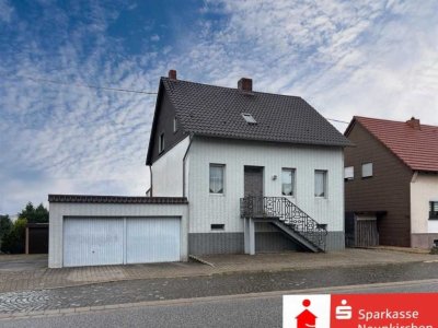 Ein Zuhause voller Potenzial mit schönem Garten und Doppelgarage