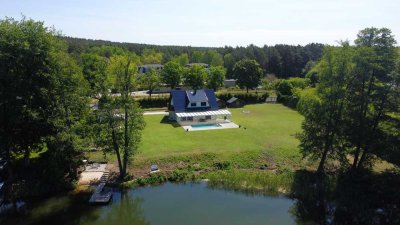 Exklusives Wassergrundstück mit Haus und eigenem Steg am Motzener See