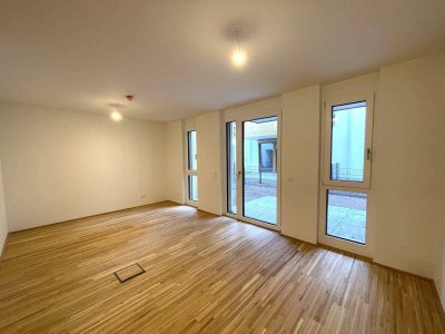 Tolle 1-Zimmer Wohnung mit eigenem Garten zum Genießen! Erstbezug in toller Lage und provisionsfrei