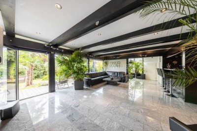 Exklusives HUF HAUS mit Wintergarten, Sauna + Gartenoase "Wohnen in seiner schönsten Form"
