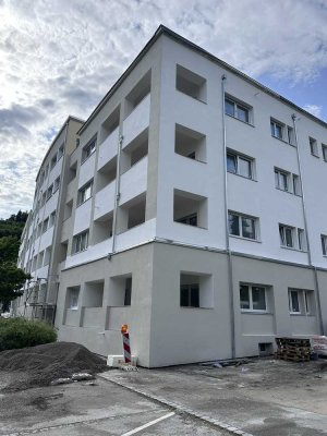Erstbezug nach Kernsanierung – Moderne 3-Zimmer-Wohnung mit Stellplatz für E-Auto