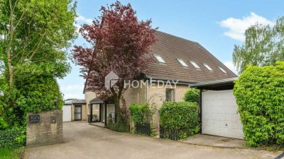 Großzügige Erdgeschosswohnung mit Gartenidylle und Komfort im Zweifamilienhaus