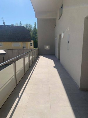 Erstbezug - Maisonettewohnung mit überdachter Terrasse, Garten und Garage