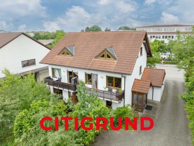 Unterschleißheim - Gepflegtes Mehrfamilienhaus mit drei Wohneinheiten und sonnigem Garten