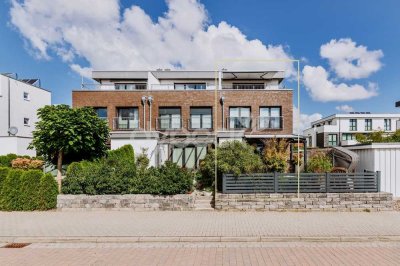 Modernes Zuhause mit Wohlfühlcharakter – KfW-70-Townhouse mit Garten, Studio und Dachterrasse.