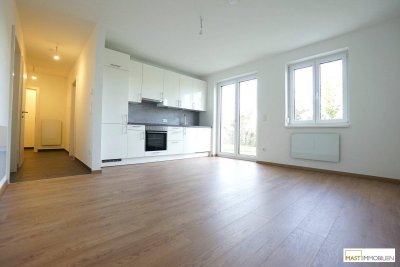 2 Zimmer Garten Wohnung inkl. EWE Einbauküche in optimaler Lage - inkl. PKW Abstellplatz