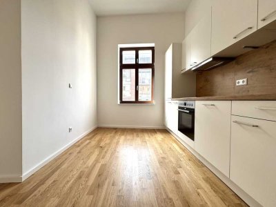 *Erstbezug*: 3-Raum-Wohnung mit Terrasse, hochwertiger EBK und Tageslichtbad in bester Wohnlage