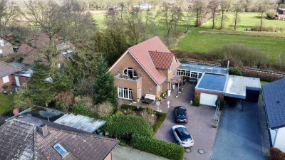 Attraktive Erdgeschosswohnung mit Garten, Terrasse und Garage in einem gepflegten Zweifamilienhaus