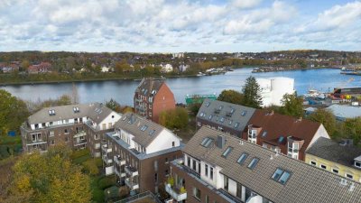Vermietete Eigentumswohnung mit Terrasse und 6 Garagenstellplätzen