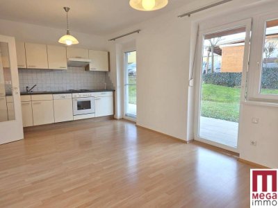 Sonnige Erdgeschoss-Wohnung mit Terrasse und Gartenanteil