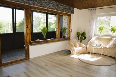 3,5 Zimmerwohnung mit Wintergarten und eigenem Garten mit Terrasse  in Südseite!