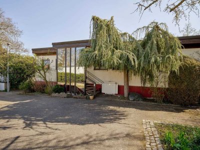 Charmanter Bungalow mit Wintergarten, Einliegerwohnung und Garten