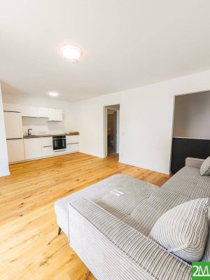 Moderne 1-Zimmer-Wohnung mit separatem Schlafbereich und Außenfläche in ruhiger Lage