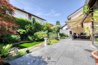 Wohnoase mit Stil: Doppelhaushälfte mit Wintergarten, Pool & Garage