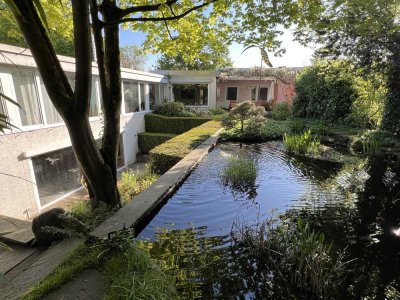 Ein Haus wie kein anderes – stilvolle Wohn-Oase mit Gartenidylle und viel Privatsphäre