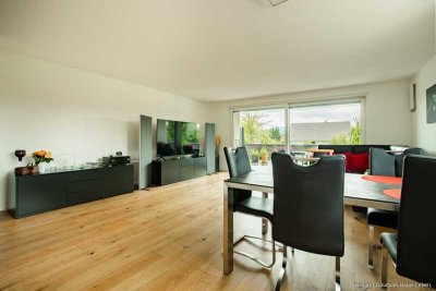 Neuwertige Erdgeschosswohnung mit Terrasse, Garten und Tiefgaragenstellplatz