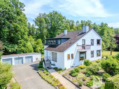 Großzügiges Zweifamilienhaus auf parkähnlichem Grundstück in Vögelsen