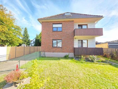 Zweifamilienhaus mit Charme: Gartenblick, 4 Balkone, DG-Ausbau, Garagen und Vollkeller in Langen!