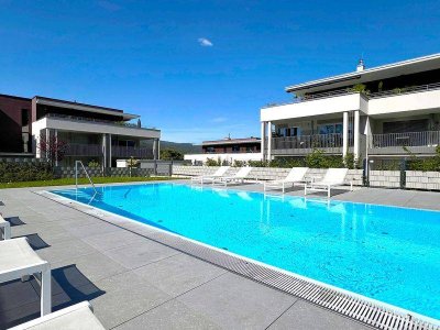 2.Seereihe! Exklusive 3-Zimmer-Wohnung mit direktem Poolzugang und XXL Terrasse