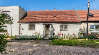 Sanierungsbedürftiges Reihenmittelhaus mit Nebengebäuden und Potenzial in ruhiger Lage von Beidersee