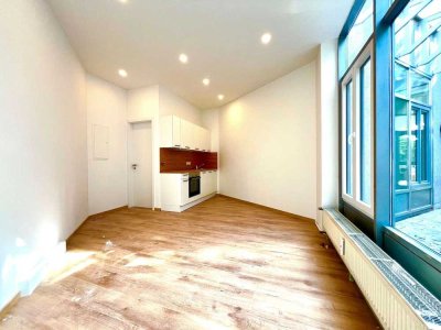 Zentrales Einzimmer-Apartment mit Küchenzeile und Außenstellplatz in der Augsburger Innenstadt
