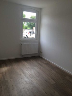 Erdgeschosswohnung mit Terrasse