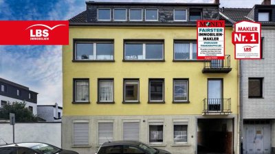 Mehrfamilienhaus mit 5 Wohneinheiten mit Balkonen und einer Gewerbehalle