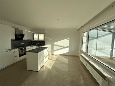 Moderne 3,5-Zimmer-Wohnung mit offener Küche, hochwertiger Einbauküche und großem Süd-Balkon