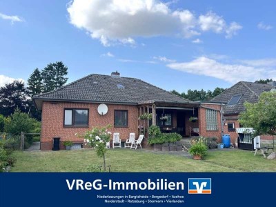 Einfamilienhaus mit Garage und schönem Grundstück zu verkaufen