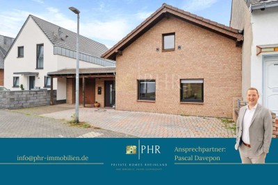 Modernisiertes Einfamilienhaus in ruhiger Wohnlage mit Garten und Garage.