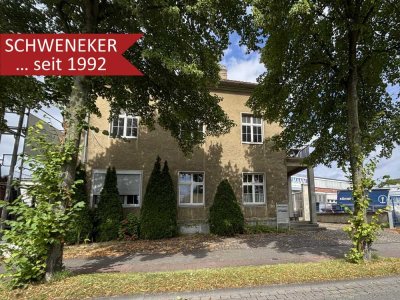 Vermietetes, zentral gelegenes Zweifamilienhaus mit Werkstatt und Garagen!